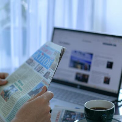 Man Hands Holding Newspaper